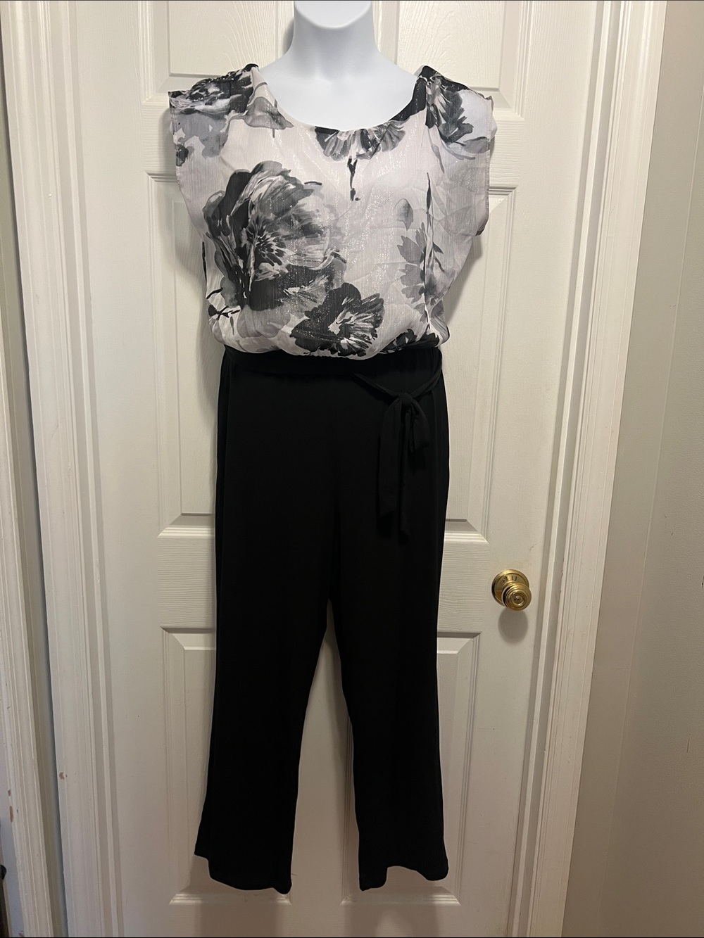 Sleeveless Black Jumpsuit with Monochrome Floral Overlay